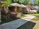 Beautiful landscaped front yard with a stone paver walkway leading to the front door at 736 Silverwood Dr, Lake Mary, FL 32746