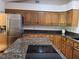 Spacious kitchen with stainless steel refrigerator and granite countertops at 736 Silverwood Dr, Lake Mary, FL 32746