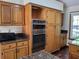 Kitchen with stainless steel ovens and granite countertops at 736 Silverwood Dr, Lake Mary, FL 32746