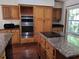 Kitchen with stainless steel ovens and granite countertops at 736 Silverwood Dr, Lake Mary, FL 32746