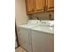 Functional laundry area featuring a white Amana washer and dryer set for easy laundry tasks at 736 Silverwood Dr, Lake Mary, FL 32746