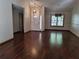 Spacious living room features hardwood floors, front door, and large windows at 736 Silverwood Dr, Lake Mary, FL 32746