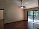 Open living room with pool view and ceiling fan at 736 Silverwood Dr, Lake Mary, FL 32746