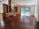 Living room with hardwood floors, fireplace, built-in shelves, and access to the patio at 736 Silverwood Dr, Lake Mary, FL 32746