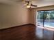 Inviting living room with beautiful hardwood floors and sliding glass doors to the patio at 736 Silverwood Dr, Lake Mary, FL 32746