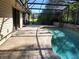 A partially shaded patio leads to a pool enclosed with screens for comfortable outdoor living at 736 Silverwood Dr, Lake Mary, FL 32746