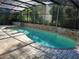 Beautiful screened pool area with brick accents offers a serene, private outdoor retreat at 736 Silverwood Dr, Lake Mary, FL 32746
