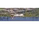 Aerial view showcasing the community's pool, amenities, and beautiful lakefront setting at 806 Lucaya Loop, Davenport, FL 33897