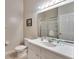 Clean and modern bathroom with a spacious vanity, large mirror, and walk-in shower at 806 Lucaya Loop, Davenport, FL 33897