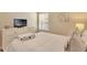 Cozy bedroom with soft lighting, dresser, and comfortable bedding at 806 Lucaya Loop, Davenport, FL 33897