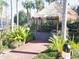 Community offers a lakeside cabana surrounded by lush greenery, providing a tranquil space for relaxation and gatherings at 806 Lucaya Loop, Davenport, FL 33897