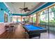 Relaxing game room featuring a pool table and tables perfect for socializing with Gathering and friends at 806 Lucaya Loop, Davenport, FL 33897