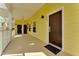 Inviting yellow hallway leading to unit 806, with a clean and well-maintained appearance at 806 Lucaya Loop, Davenport, FL 33897