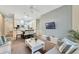 Open-concept living room with a view of the dining area and kitchen, perfect for entertaining at 806 Lucaya Loop, Davenport, FL 33897
