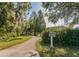 Scenic nature trail winding through lush landscaping and trees, perfect for walking at 806 Lucaya Loop, Davenport, FL 33897