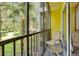 Screened-in patio with seating area and view of the landscaped grounds at 806 Lucaya Loop, Davenport, FL 33897
