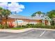 Community restaurant with ample parking, a sign, 'Tradewinds Restaurant' and bar, offers convenient dining on site at 806 Lucaya Loop, Davenport, FL 33897