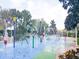 The community splashpad features vibrant water features, inviting residents to cool off and enjoy outdoor recreation at 806 Lucaya Loop, Davenport, FL 33897