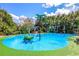 Community splashpad with playful water features, including colorful arches, for Gathering-friendly fun on a sunny day at 806 Lucaya Loop, Davenport, FL 33897