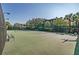 Community tennis court with well-maintained green surface, perfect for recreation at 806 Lucaya Loop, Davenport, FL 33897