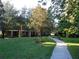 Well-maintained walking path through beautifully landscaped green spaces with mature trees at 806 Lucaya Loop, Davenport, FL 33897