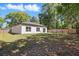 Large backyard with a well-maintained lawn, patio, and fenced perimeter for privacy at 851 W 24Th Pl, Sanford, FL 32771
