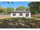 Large backyard with a well-maintained lawn, patio, and fenced perimeter for privacy at 851 W 24Th Pl, Sanford, FL 32771