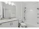 Spotless bathroom with granite-topped vanity, subway tiles, and a shower-tub combination for ultimate relaxation at 851 W 24Th Pl, Sanford, FL 32771