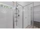 Shower with subway tile and glass door next to the linen closet and doorway at 851 W 24Th Pl, Sanford, FL 32771