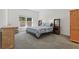 Comfortable carpeted bedroom with natural light from the large window at 851 W 24Th Pl, Sanford, FL 32771