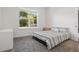Cozy bedroom with a large window, light walls, and soft carpeting, offering a serene retreat at 851 W 24Th Pl, Sanford, FL 32771