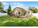 Fenced backyard featuring a screened lanai and lush lawn at 9054 Sandwood Way, Orlando, FL 32832
