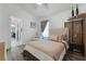 Comfortable bedroom with laminate flooring and a cozy seating area at 9054 Sandwood Way, Orlando, FL 32832