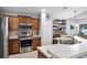 Modern kitchen featuring stainless steel appliances, wooden cabinets, and a bright, open layout at 9054 Sandwood Way, Orlando, FL 32832