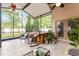 Relaxing screened lanai featuring tile floors, ceiling fan, and a hot tub at 9054 Sandwood Way, Orlando, FL 32832