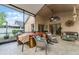 Covered screened lanai with tile floors, ceiling fan, and hot tub at 9054 Sandwood Way, Orlando, FL 32832