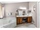 This spacious bathroom features dual sinks, and a large soaking tub at 9054 Sandwood Way, Orlando, FL 32832