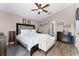 Spacious main bedroom featuring a ceiling fan, walk in closet, and en suite bathroom at 9054 Sandwood Way, Orlando, FL 32832