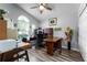 Inviting office space with natural light, laminate flooring, and ample desk space at 9054 Sandwood Way, Orlando, FL 32832