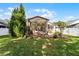 A beautifully screened patio surrounded by well-maintained landscaping with an arched trellis feature at 9054 Sandwood Way, Orlando, FL 32832