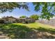 Backyard with a shed and a screened pool area, all within a fenced yard at 9501 Holbrook Dr, Orlando, FL 32817
