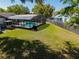 A spacious backyard with a screened pool enclosure offers outdoor entertainment and relaxation at 9501 Holbrook Dr, Orlando, FL 32817