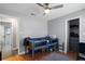 This bedroom offers wood floors, gray walls, and a loft bed, leading to the bathroom at 9501 Holbrook Dr, Orlando, FL 32817