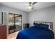 The room has a sliding glass door, which leads to the screened-in lanai and pool area at 9501 Holbrook Dr, Orlando, FL 32817