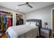 Bedroom featuring an open closet and comfortable queen bed at 9501 Holbrook Dr, Orlando, FL 32817