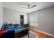 This bedroom has wood floors, a loft bed with space bedding and closet at 9501 Holbrook Dr, Orlando, FL 32817