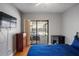 Relaxing bedroom featuring a sliding glass door with direct access to the pool at 9501 Holbrook Dr, Orlando, FL 32817