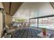 This is a covered patio with a dining area and a clear view of the pool and screened enclosure at 9501 Holbrook Dr, Orlando, FL 32817