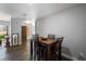 Dining room featuring wood floors and a wooden table with seating for four at 9501 Holbrook Dr, Orlando, FL 32817