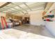 Functional garage with built-in shelving, a work area, and plenty of open space at 9501 Holbrook Dr, Orlando, FL 32817